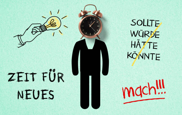 istock classical copper colored alarm clock and a drawn person in a Wake Up concept with stroked German text 