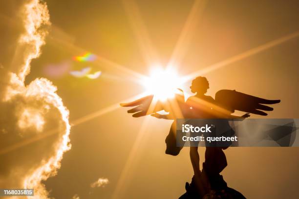 Angel With Sunbeams Stock Photo - Download Image Now - Archangel, Archangel Michael, Sky