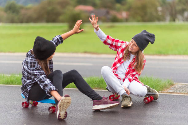 istock Happy little girls giving high five 1168037011