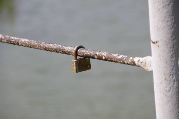istock the lock hangs on a steel rod 1168038535