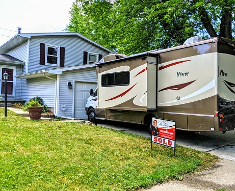 Urbana, Illinois, August 14, 2019 - Home owners have sold their house to begin travel around the USA full time and live in their rv motor home