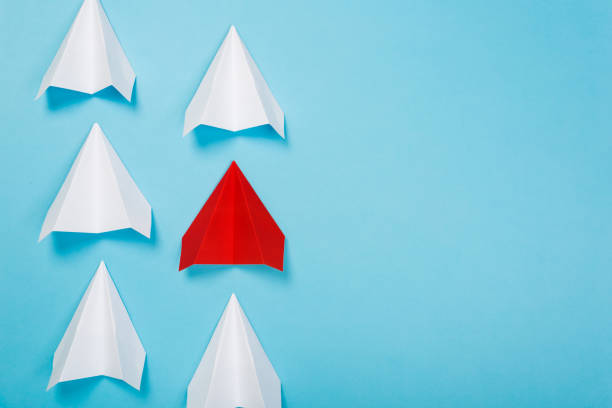 istock Red paper plane are different from others on blue background. Think different. Business for innovative, solution concepts 1168039769