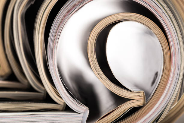 istock selective focus of the stacking magazine place on white background. Colorful abstract background 1168039868