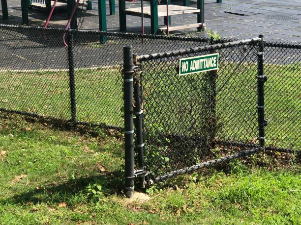 istock No Admittance sign on fence - funny 1168041873