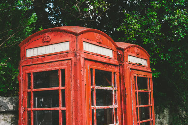 istock Pair of old fashioned red British telephone boxes 1168041986