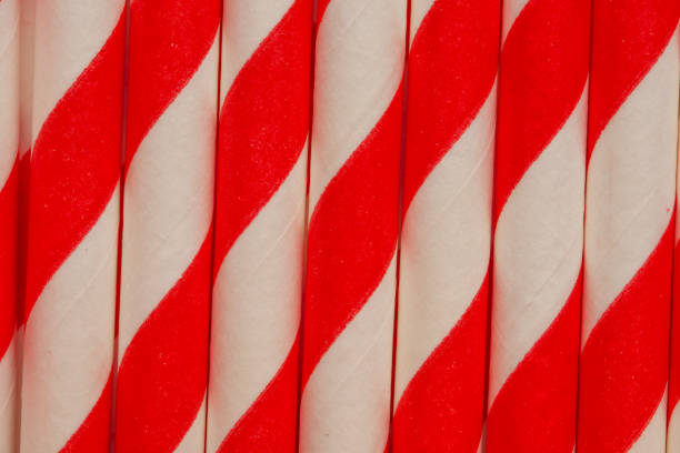istock Background from red-white tubules for soda, close-up, macro, horizontal frame 1168041991