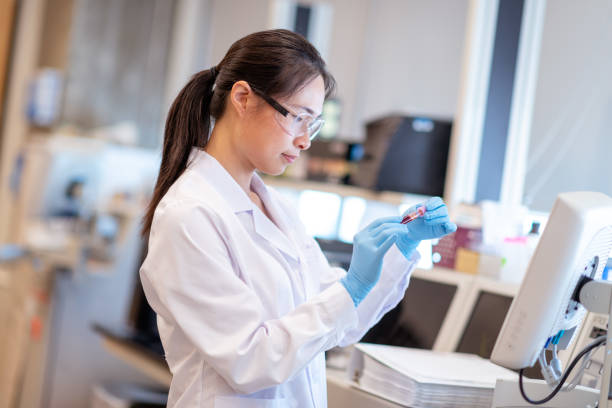 istock Female scientist using chemistry analyzer to get results from scientific sample 1168042041