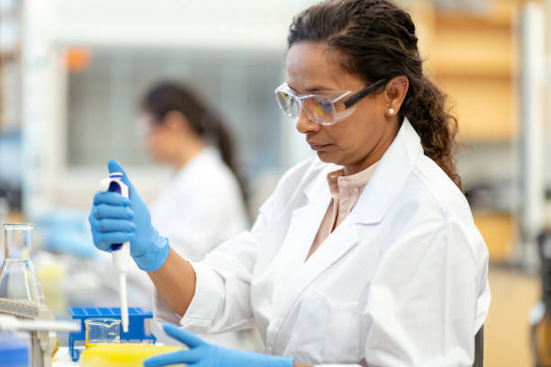 istock Female scientist pipetting in laboratory 1168042048