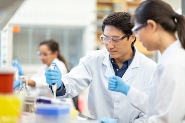 istock Multi-ethnic team of chemists working in laboratory 1168042073