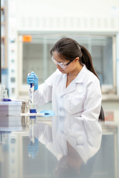istock Female scientist pipetting in laboratory 1168042194