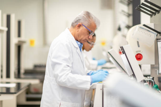 istock Male medical researcher loading a centrifuge 1168042214