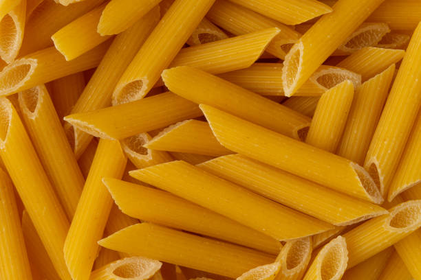 istock Background Italian pasta hard varieties, closeup. Culinary background, macro, horizontal frame 1168042373