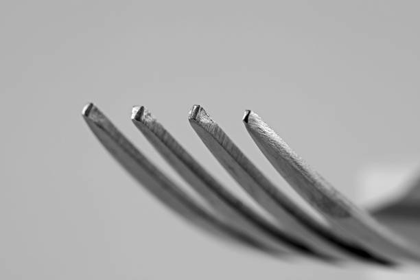 Metal fork dipping in water