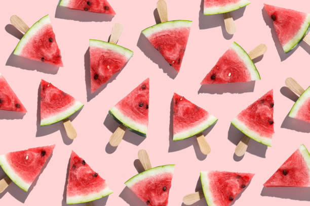 istock Sliced watermelons arranged on a pink background 1168043486