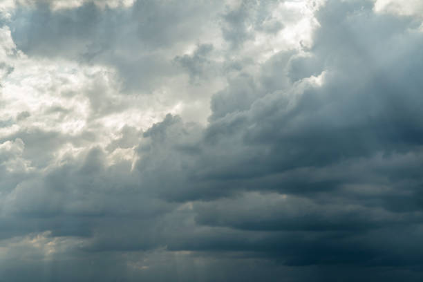 istock Dark stormy sky with sunlight shining through. 1168044540