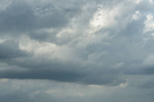 istock Dark stormy sky with sunlight shining through. 1168044578