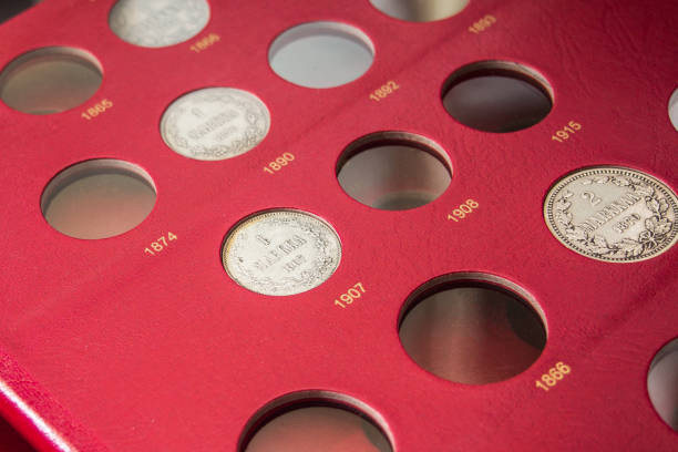 red album with old collectible finnish coins stock photo
