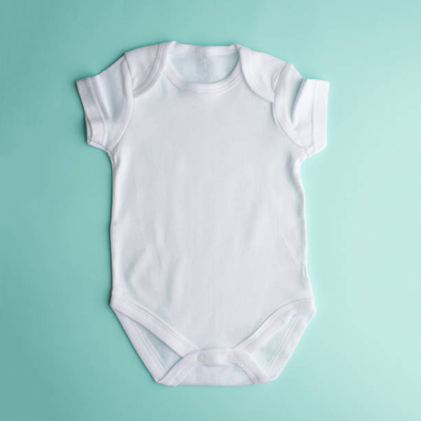 istock Flat Put a white bodysuit for a child on a neutral background. Layout for design and placement of logos, advertising 1168046137