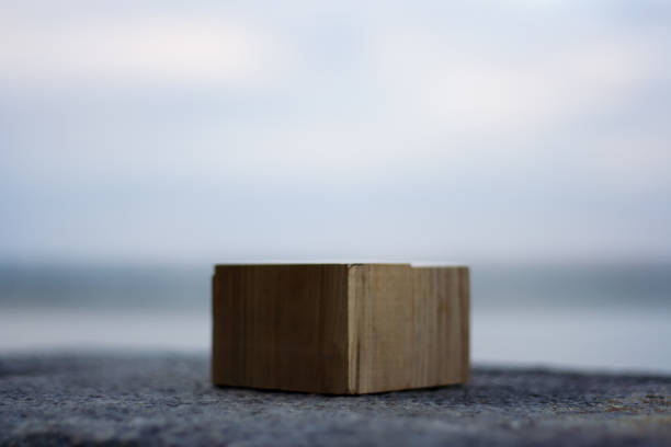 istock Wooden Cube Block outdoors on the gray rock background 1168046226