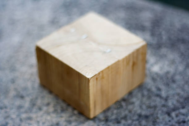 istock Wooden Cube Block outdoors on the gray rock background 1168046241
