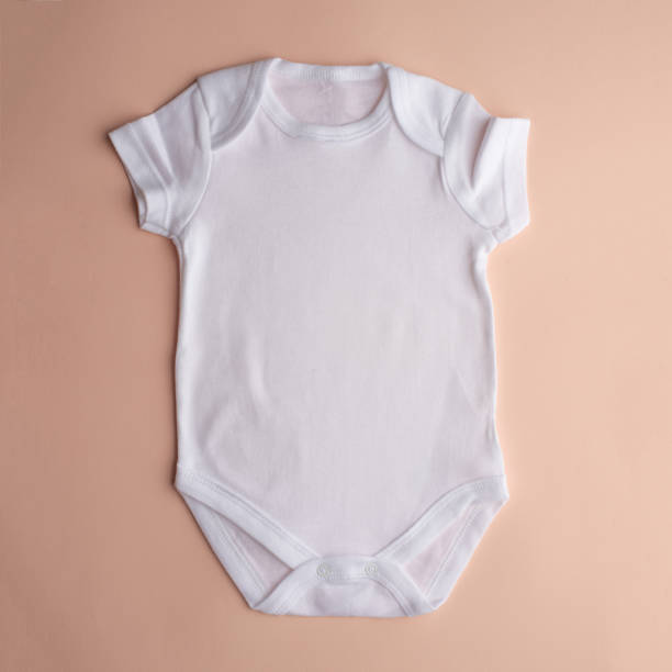 istock Flat Put a white bodysuit for a child on a neutral background. Layout for design and placement of logos, advertising 1168046329