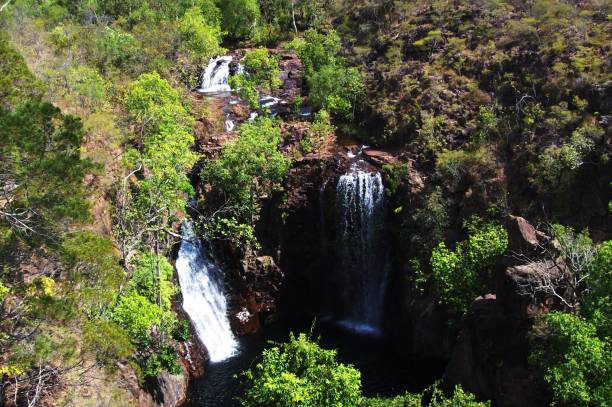 istock Triple waterfall leading into a natural swimming pool 1168051419