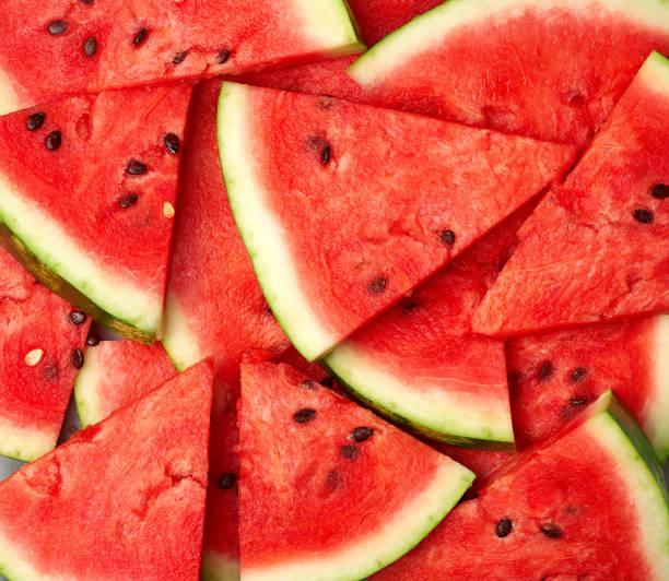 istock sliced triangular slices of ripe red watermelon with seeds 1168052736