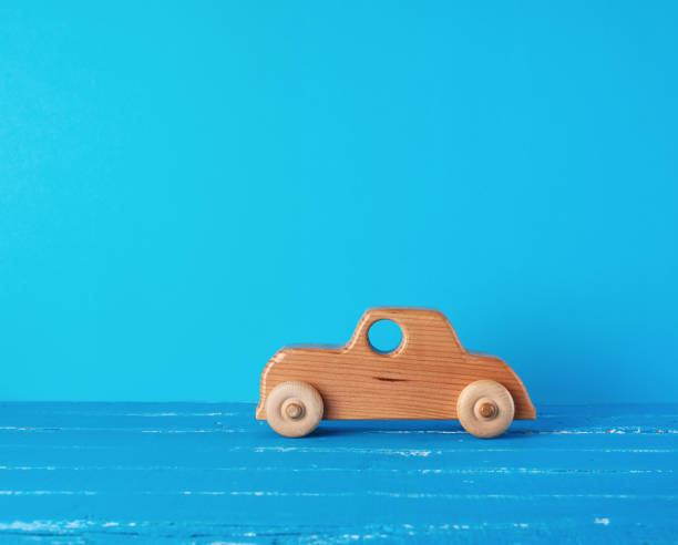 istock wooden childrens car on a blue background 1168056482