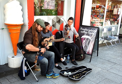 14th August 2019, Drogheda, County Louth, Ireland. Three musicians playing uilleann pipes, guitar and fiddle, at the 2019 Fleadh Cheoil na Éireann Drogheda free public Irish cultural, music and dance festival.