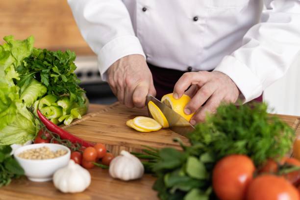istock Chef cutting fresh and delicious vegetables for cooking. 1168057719