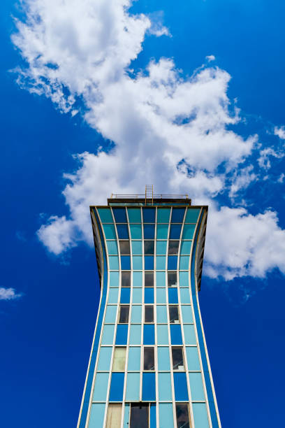 Isolated View of Decommissioned Air Traffic Control Tower at the Closed Mueller Airport in Austin, Texas, USA Isolated view of the decommissioned air traffic control tower at the closed Mueller airport in Austin, Texas in the United States on a clear day with a blue sky and fluffy clouds. austin airport stock pictures, royalty-free photos & images