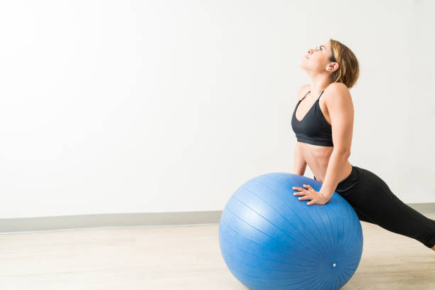 istock Pretty Lady Working Out At Yoga Studio 1168064146