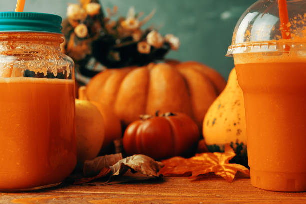 istock Pumpkins juice in bottles with pumpkins. 1168064167