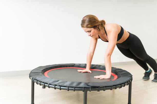 istock Beautiful Female Doing Push Ups During Fitness Workout 1168064195