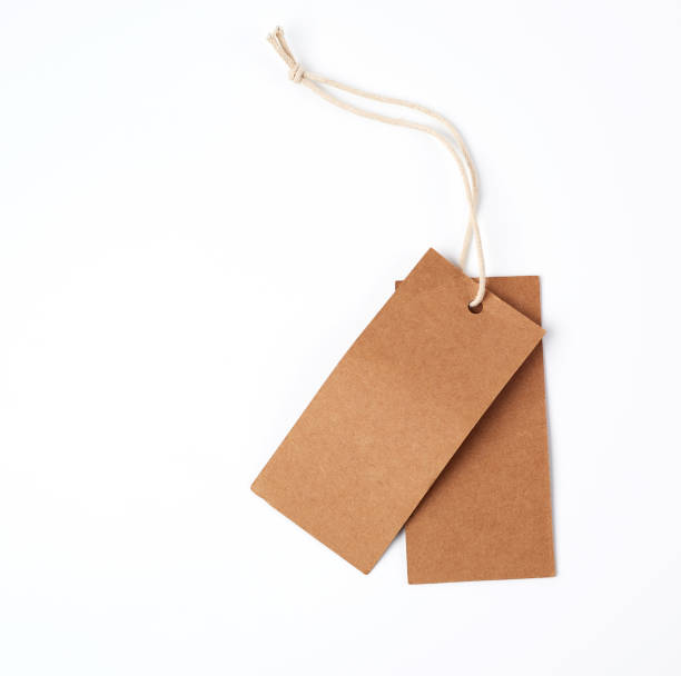 istock empty paper brown tag on the rope, white background 1168072833