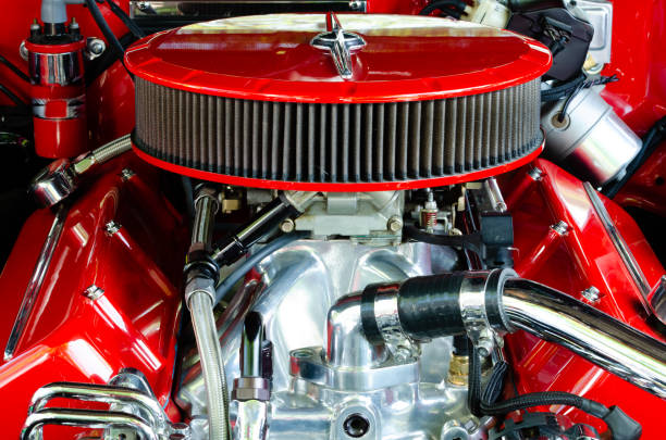istock Front symmetrical view of a streetrod engine with red air filter, valve covers and engine compartment 1168073632