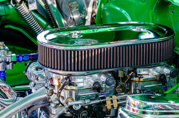 Close-up left side view of a hot rod engine with two carburetors and chrome air filter in a green engine compartment Close-up left side view of a hot rod engine with two carburetors and chrome air filter in a green engine compartment cruising hot rods stock pictures, royalty-free photos & images
