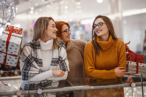 istock Mother giving her daughters presents 1168079219