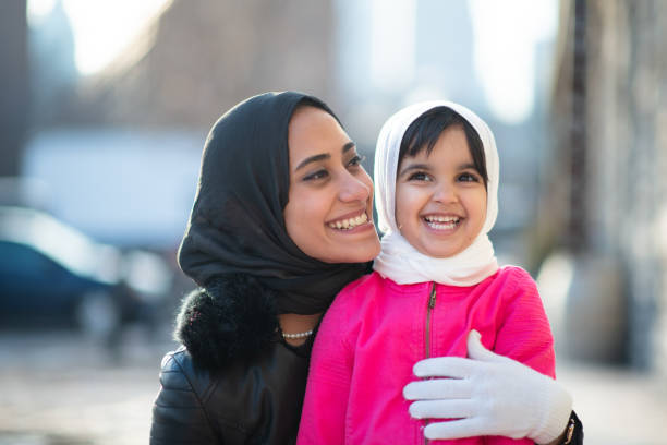 istock Smiling Muslim mother and child 1168079225