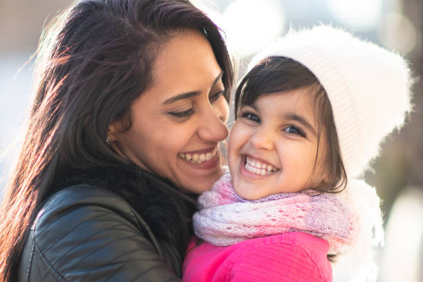 istock Smiling Muslim mother and child 1168079266