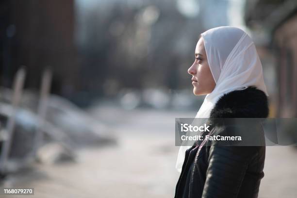 Somber Muslim Women Stock Photo - Download Image Now - Islam, Women, One Woman Only