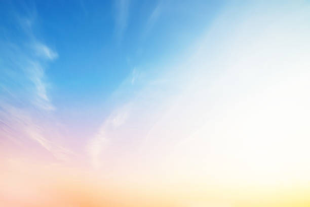 The blur pastels gradient sunset background on soft nature sunrise peaceful morning beach outdoor. heavenly mind view at a resort deck touching sunshine, sky summer clouds.