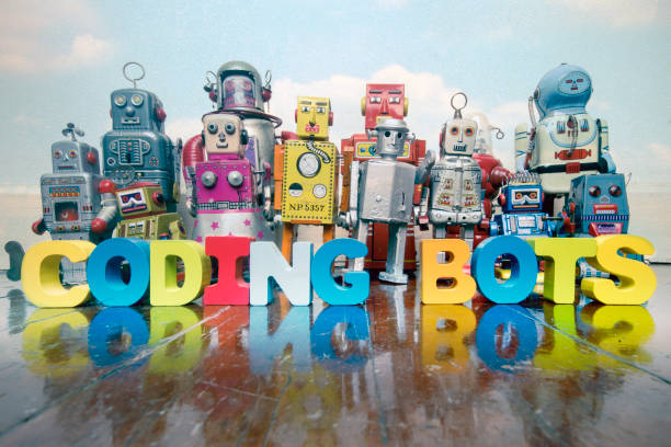 istock a team of vintage robots on a old wooden floor  with the word CODING BOTS 1168094064