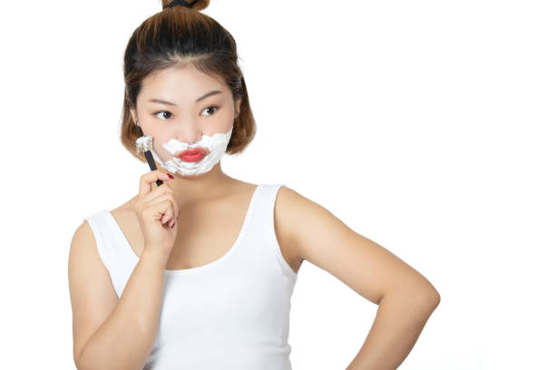 istock Chinese woman  shaving isolated on a white background 1168098063