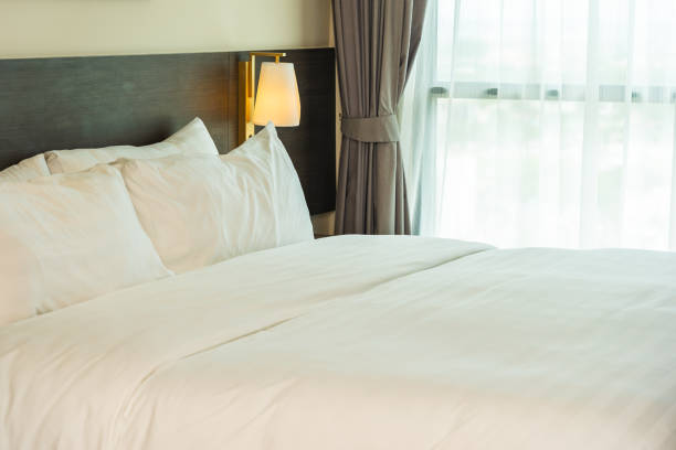 istock Beautiful luxury comfortable white pillow and blanket on bed 1168099879