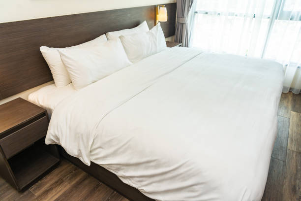 istock Beautiful luxury comfortable white pillow and blanket on bed 1168099934