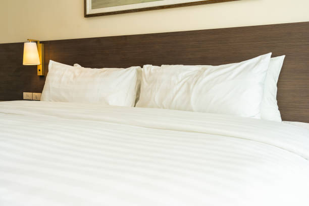 istock Beautiful luxury comfortable white pillow and blanket on bed 1168100044