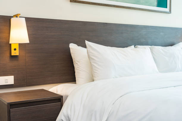 istock Beautiful luxury comfortable white pillow and blanket on bed 1168100061