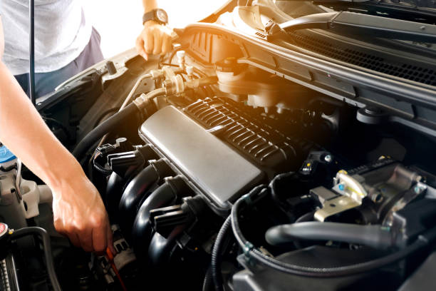 istock Car maintenance technician He is checking the auto engine, car inspection center. 1168100871