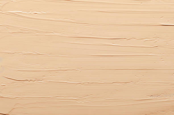 istock Nude facial foundation cream close up texture 1168101593